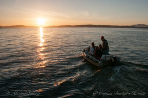 Sunset ride in the skiff to the beach to drop off our passengers