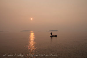 Fishing in sunset forest fire smoky haze